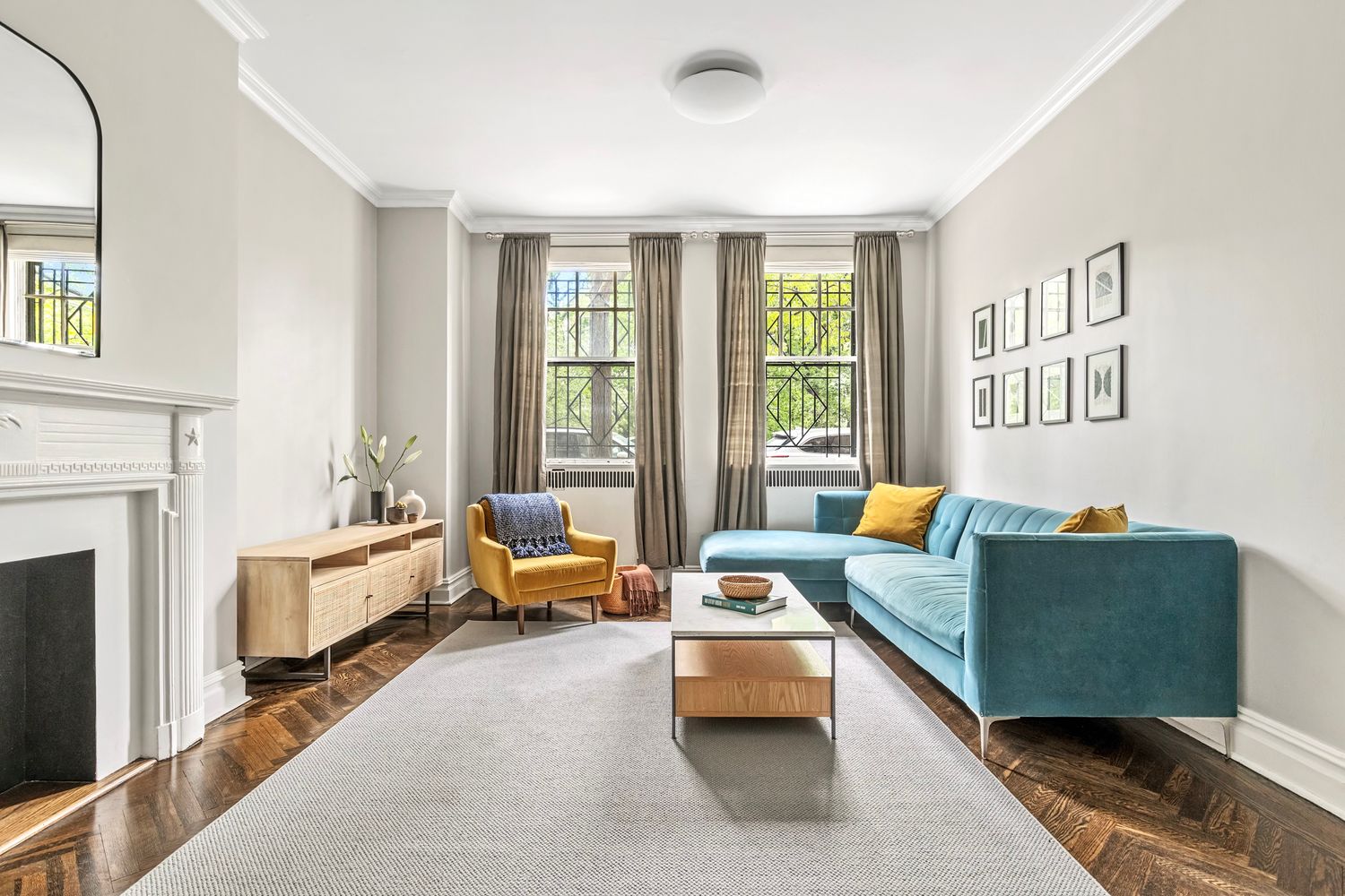 a living room with furniture and a fireplace