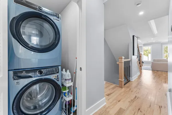 a view of a hallway with washer and dryer
