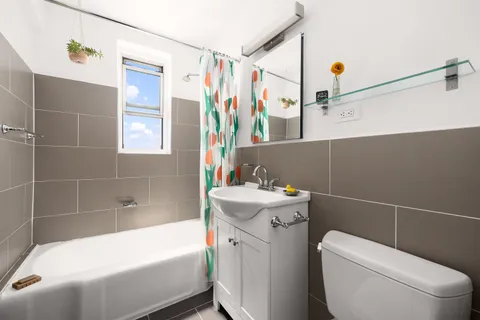 a bathroom with a sink toilet and bathtub