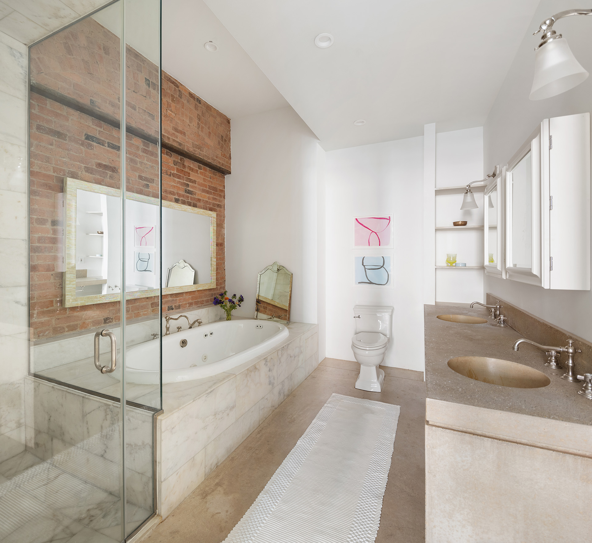 60 Warren Street, Unit 2 Manhattan, NY 10007 - Photo 10 of 16 a spacious bathroom with a tub sink and mirror