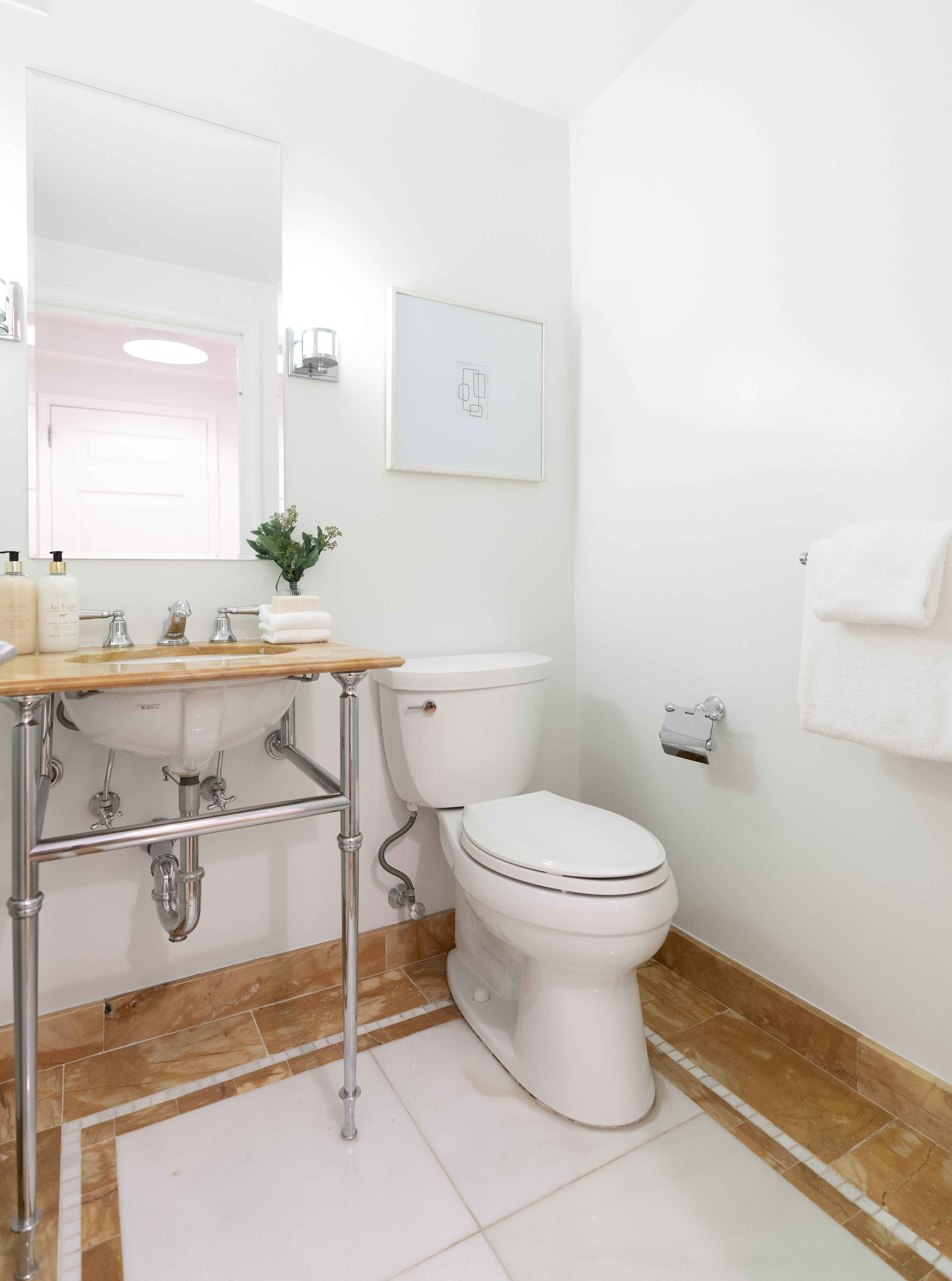 205 East 85th Street, Unit G10 Manhattan, NY 10028 - Photo 8 of 27 a bathroom with a toilet a sink and mirror