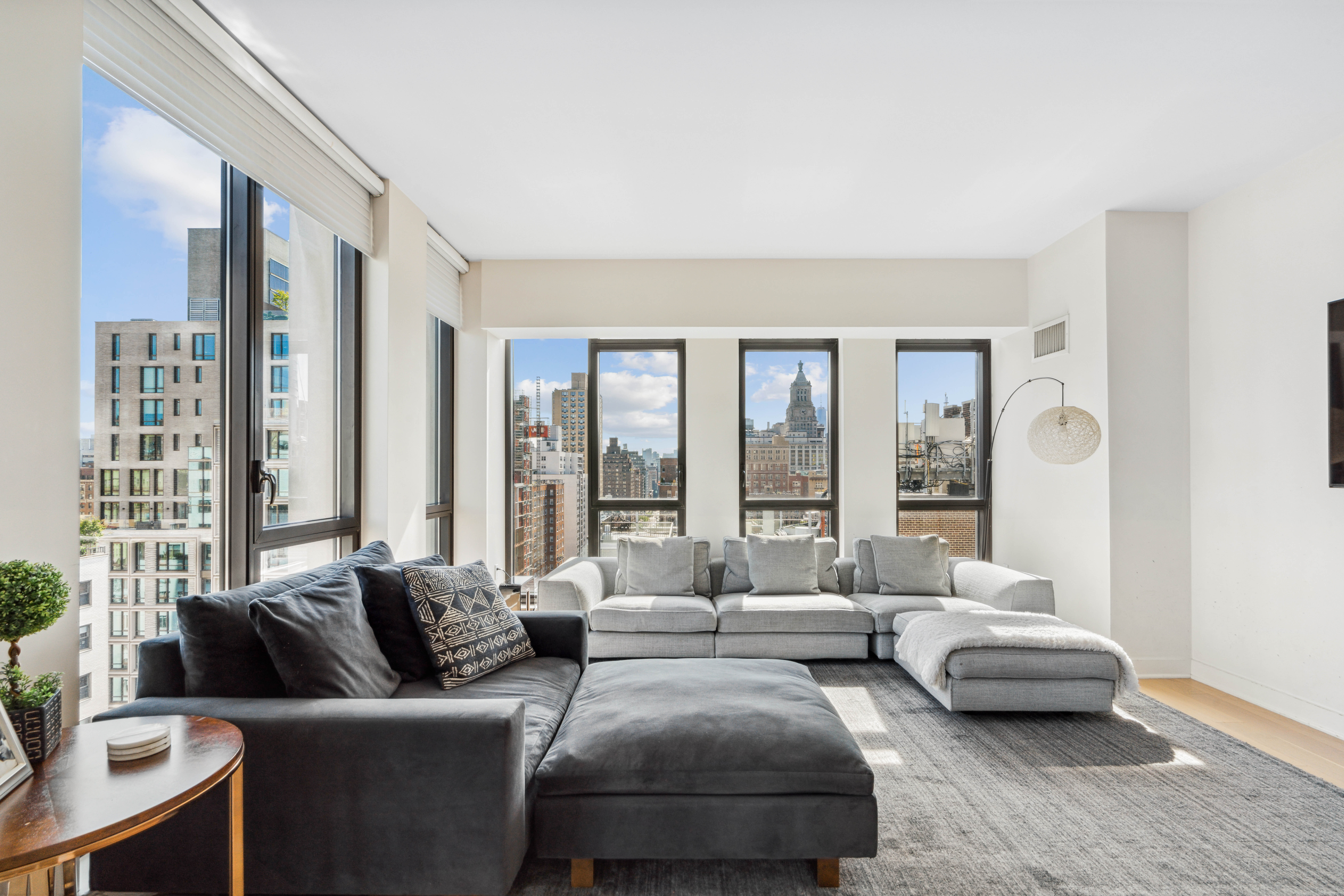 160 East 22nd Street, Unit 18C Manhattan, NY 10010 - Photo 2 of 12 a living room with furniture and a large window