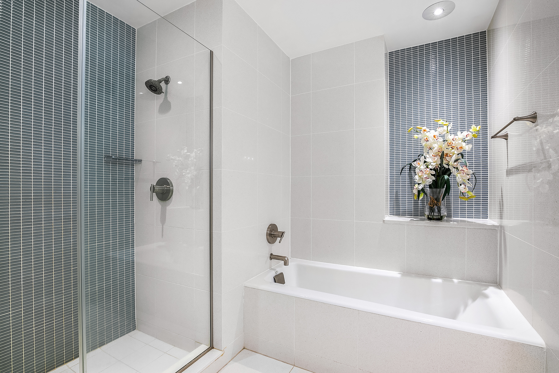 32 West 128th Street, Unit 4 Manhattan, NY 10027 - Photo 8 of 11 a white bath tub sitting next to a white toilet