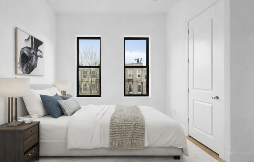 1423 Dekalb Avenue, Unit 2I Brooklyn, NY 11237 - Photo 2 of 5 a bedroom with a bed and painting on the wall
