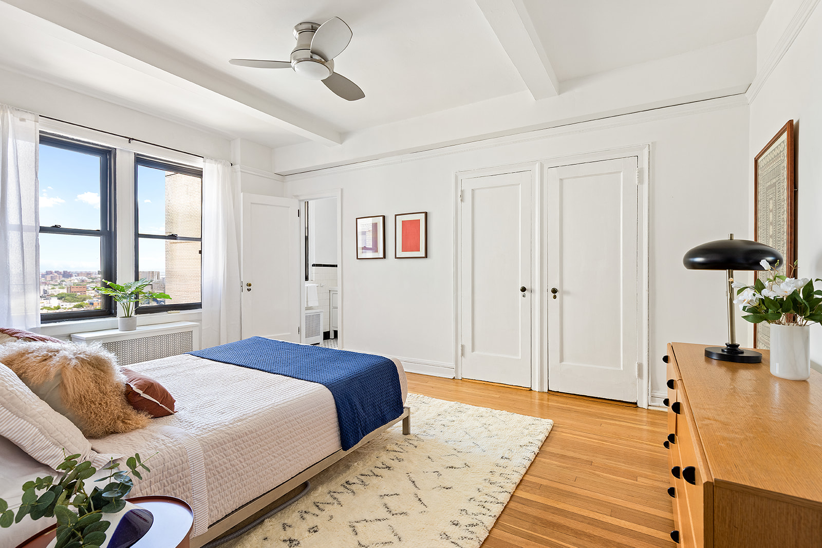 135 Eastern Parkway, Unit 14E Brooklyn, NY 11238 - Photo 7 of 16 a bedroom with a bed and wooden floor