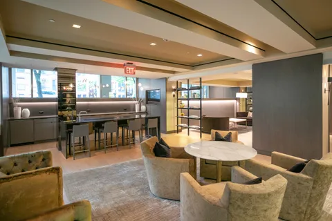 a kitchen with a table and chairs in it