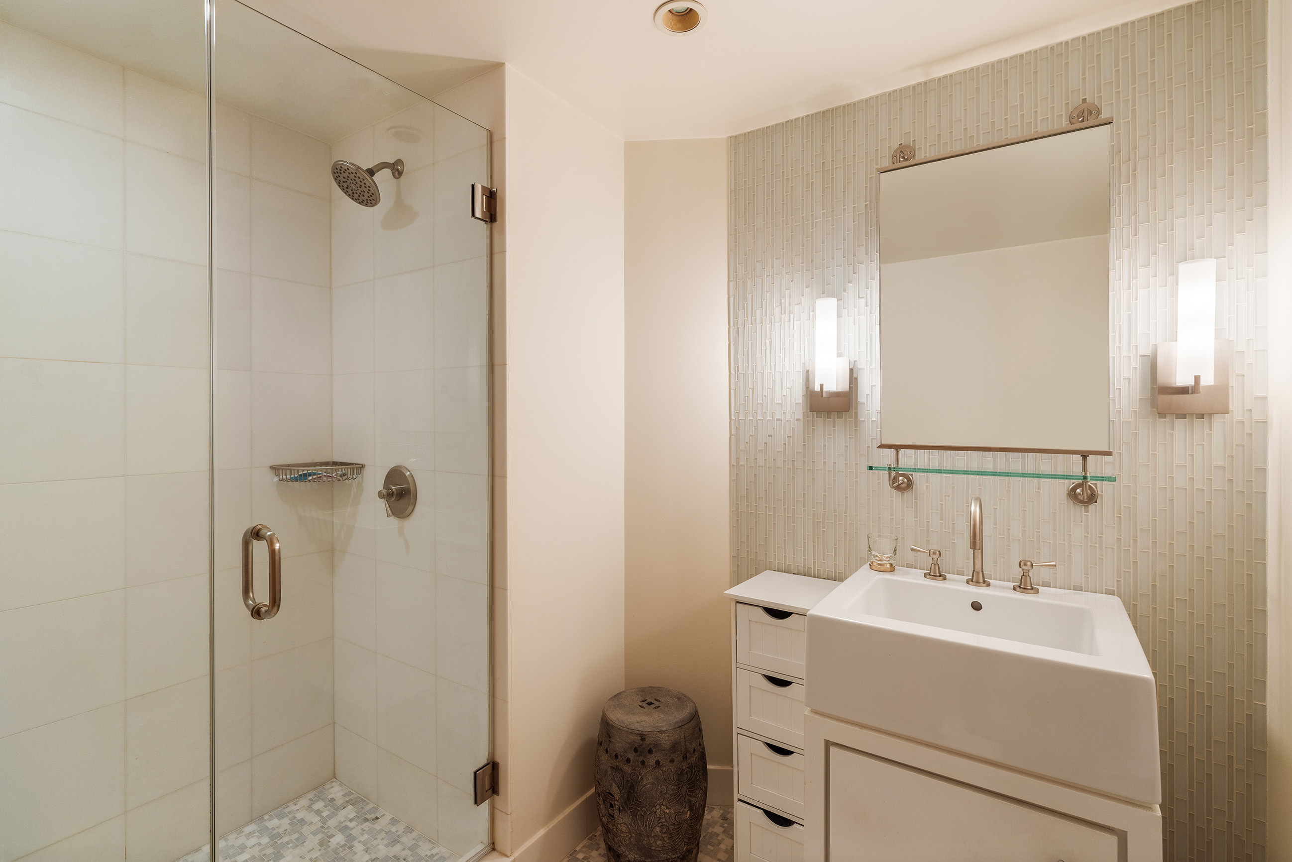 357 West 12th Street, Unit 1E Manhattan, NY 10014 - Photo 11 of 12 a bathroom with a sink a toilet and shower