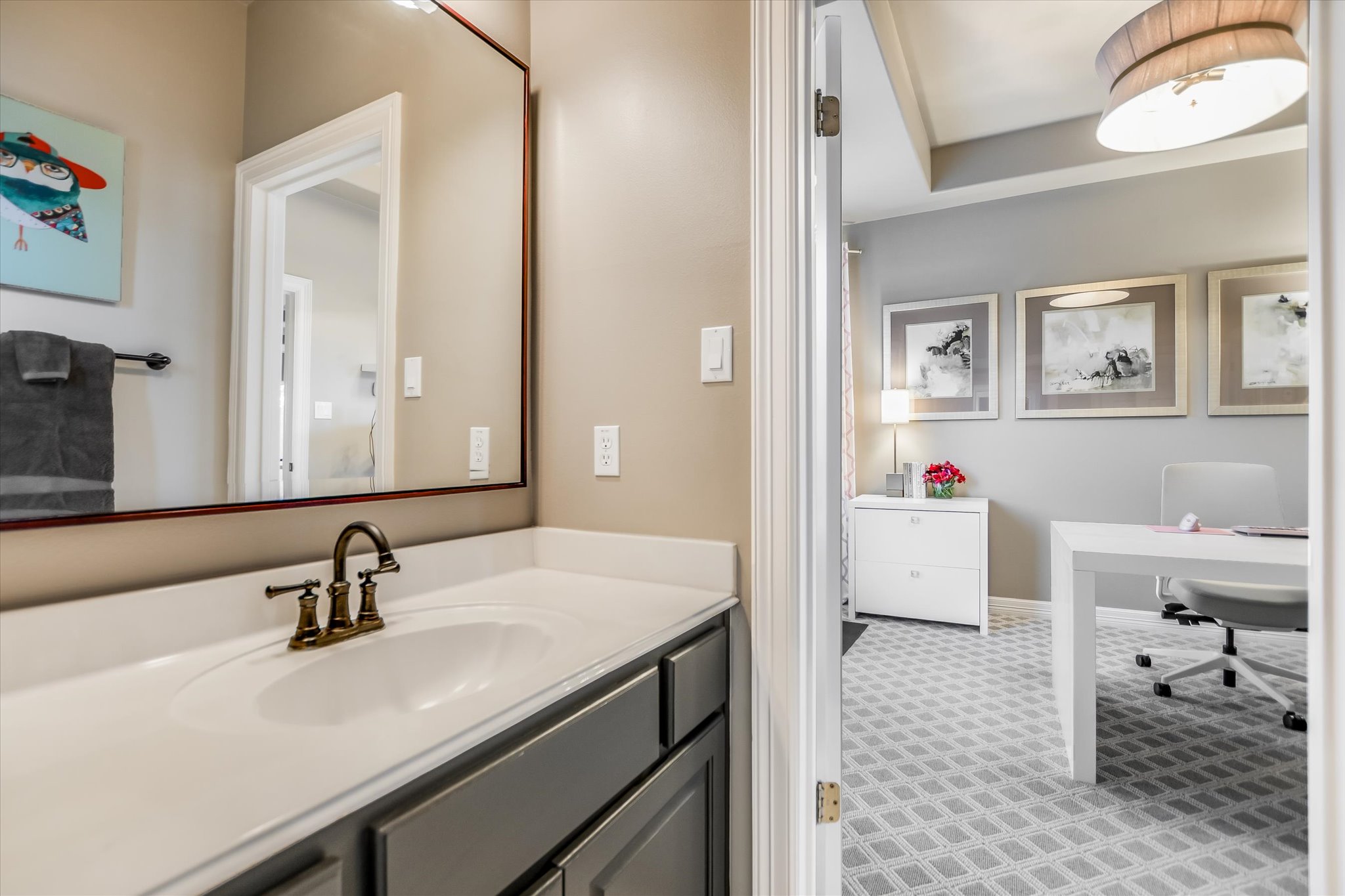 1422 Palomino Ridge Drive Austin, TX 78733 - Photo 37 of 60 a bathroom with a sink and a mirror