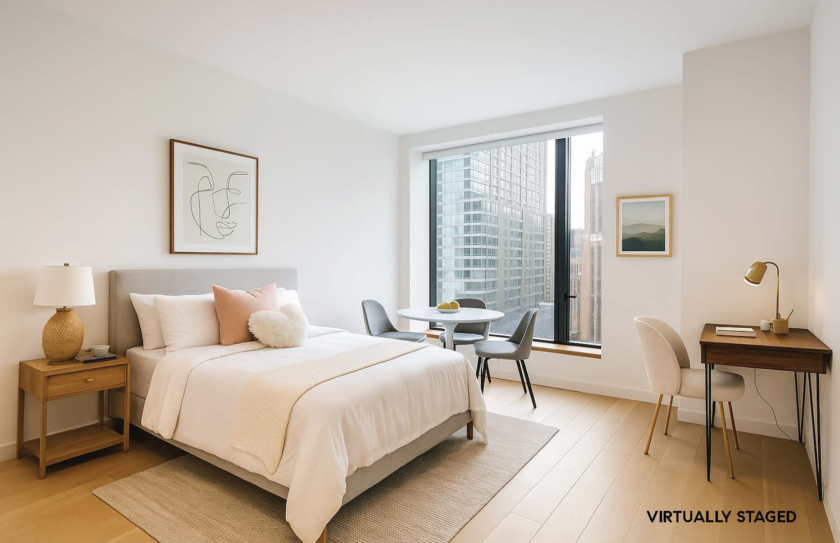 a bedroom with a bed a table and chair