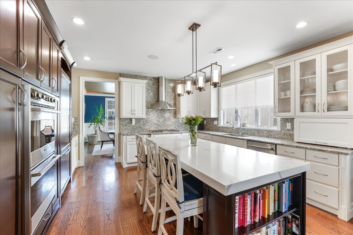 248 Valley Ridge Road Haverford, PA 19041 - Photo 11 of 44 a kitchen with stainless steel appliances granite countertop a stove a refrigerator and a kitchen island