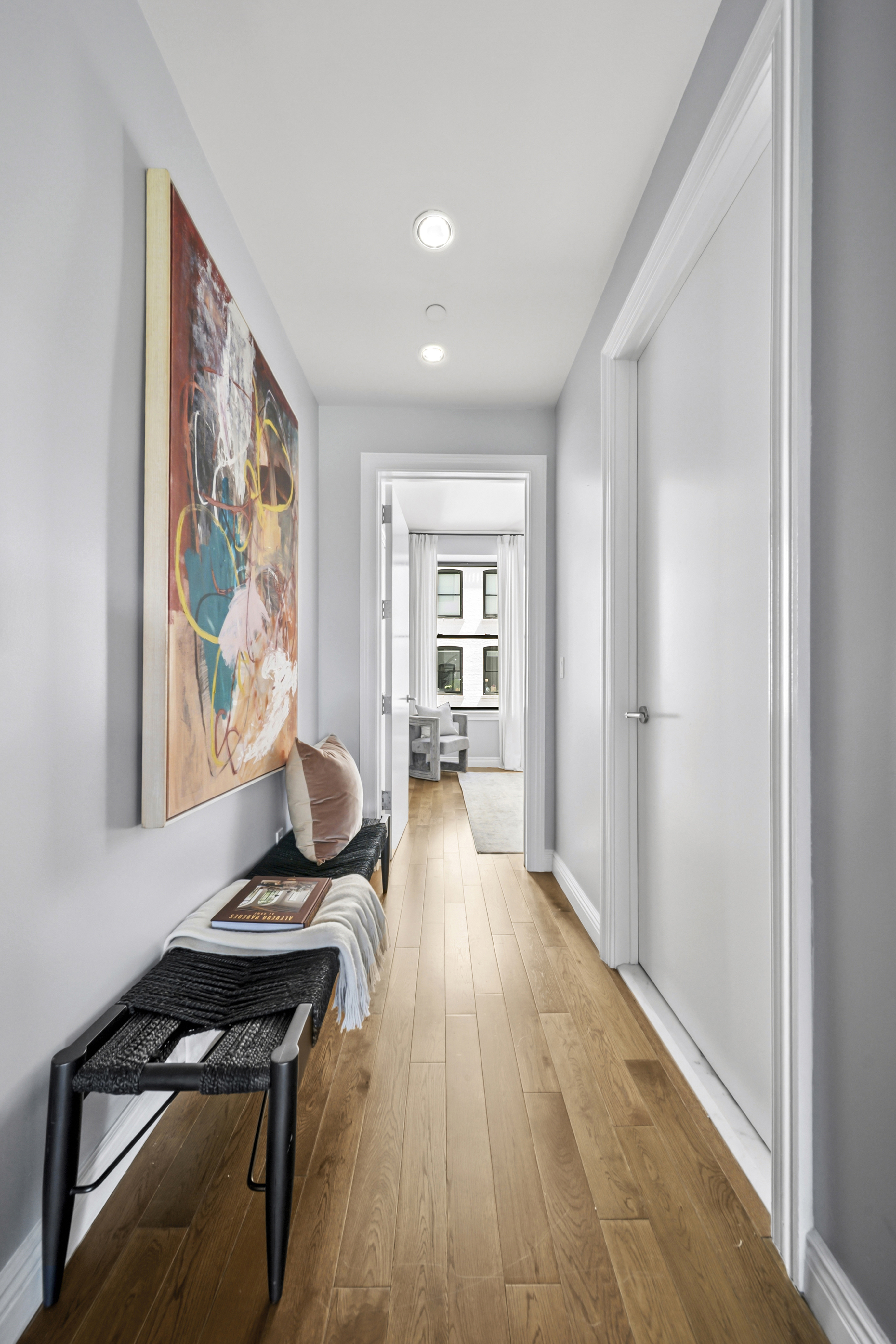 225 5th Avenue, Unit 7K Manhattan, NY 10010 - Photo 9 of 15 a view of a livingroom with furniture and wooden floor