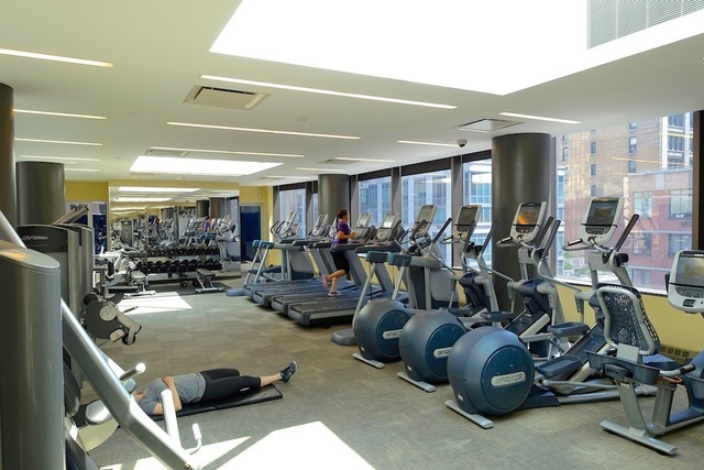 101 West 24th Street, Unit 19B Manhattan, NY 10011 - Photo 15 of 19 a room with gym equipment and a large window