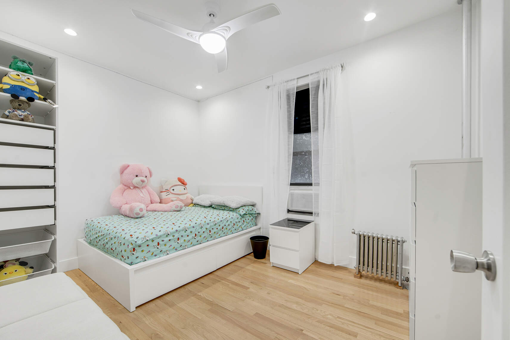 1878 Adam Clayton Powell Jr Boulevard, Unit 52 Manhattan, NY 10026 - Photo 9 of 13 a bedroom with a bed and a dresser