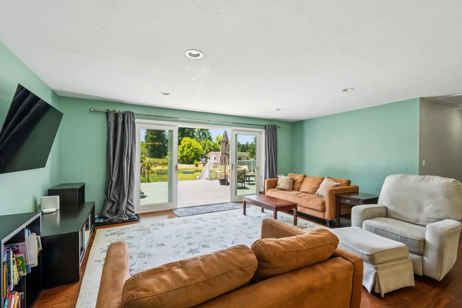 a kitchen with stainless steel appliances granite countertop a stove a sink a dining table and chairs