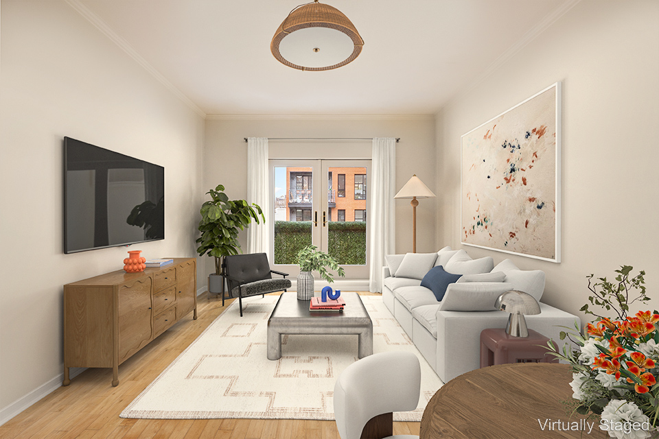 315 20th Street, Unit 3B Brooklyn, NY 11215 - Photo 2 of 9 a living room with furniture and a flat screen tv