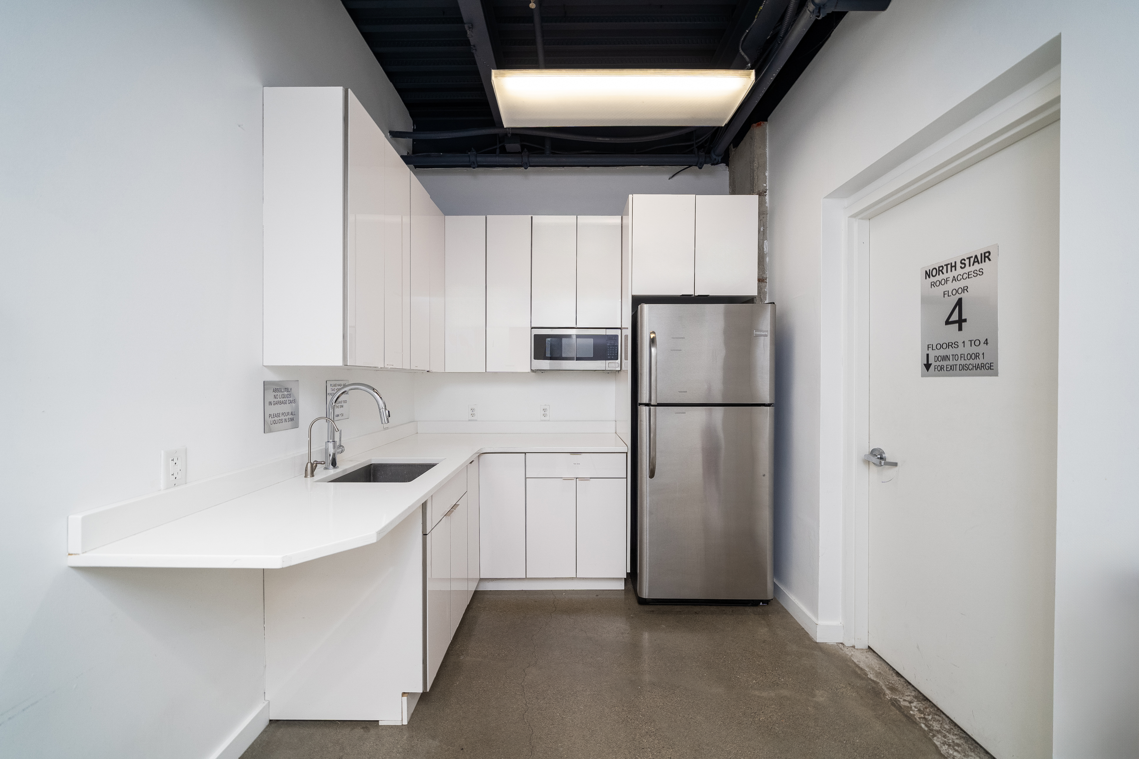 258 Newark Street, Fl 4 Hoboken, NJ 07030 - Photo 12 of 35 a kitchen with stainless steel appliances a refrigerator sink and cabinets