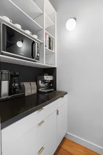 a kitchen with a microwave and cabinets