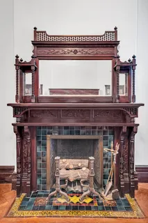 a fireplace with a clock on top of it