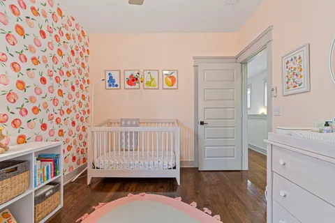 a bedroom with a bed rug and window
