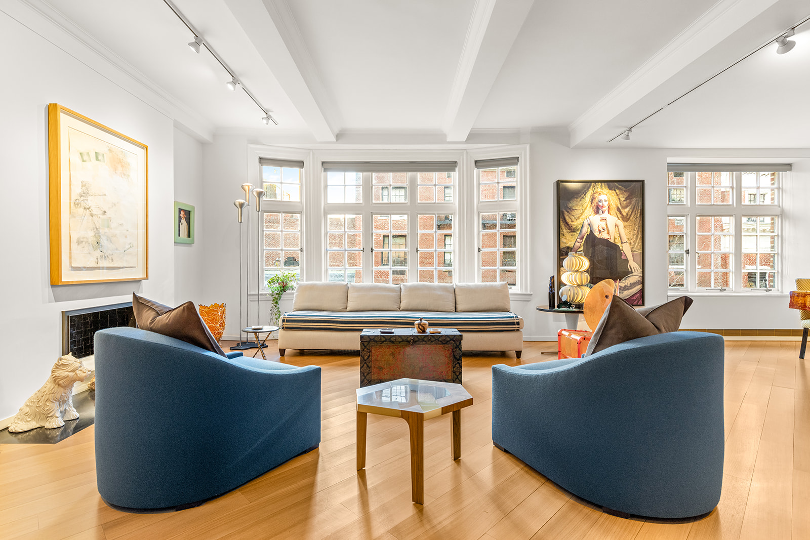 40 East 62nd Street, Unit 6E Manhattan, NY 10065 - Photo 2 of 25 a living room with fireplace furniture and a large window
