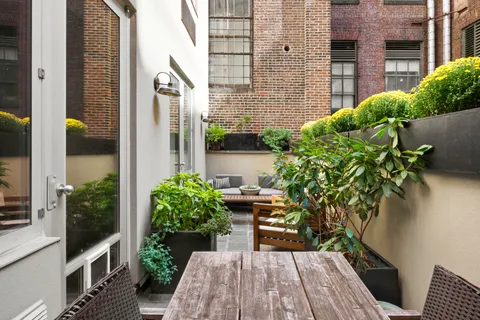 a view of a backyard with plants