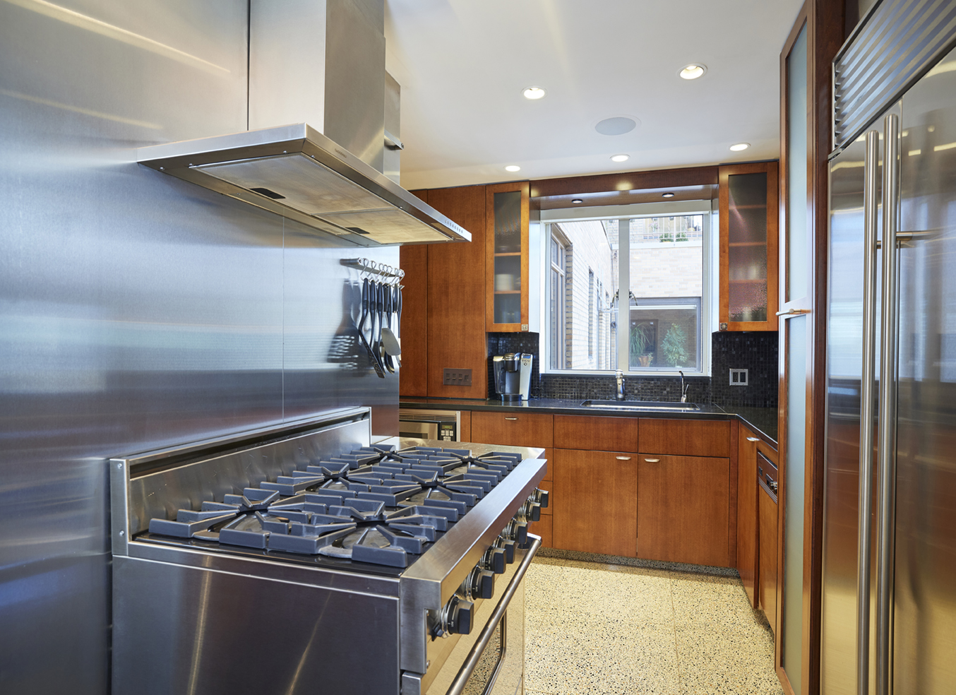 115 Central Park West, Unit 18JK Manhattan, NY 10023 - Photo 9 of 25 a kitchen with a stove and a tub