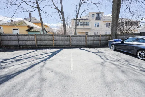 a view of a parking space with street view