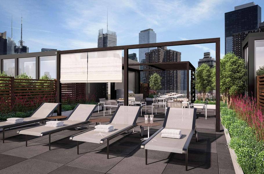 540 West 49th Street, Unit 405S Manhattan, NY 10019 - Photo 10 of 12 a view of a patio with a dining table and chairs