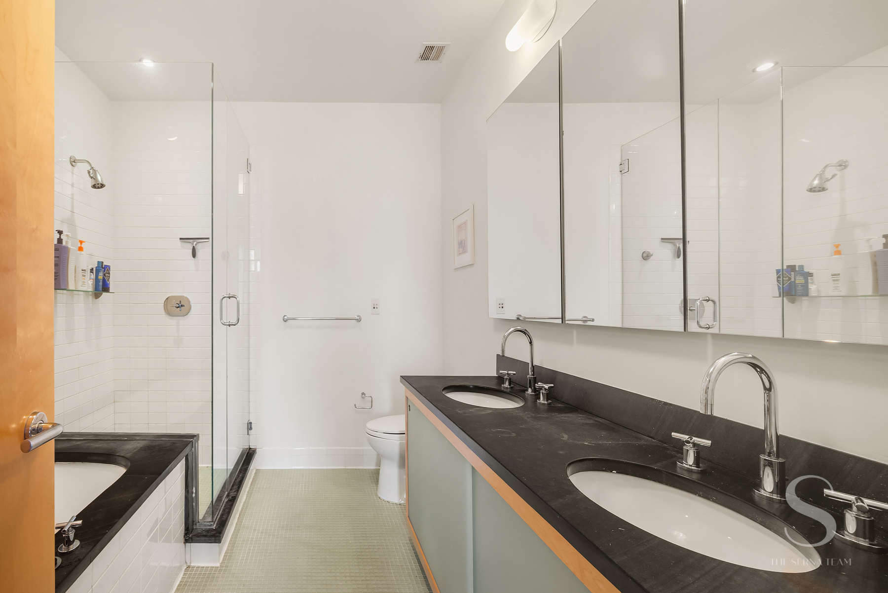 70 Washington Street, Unit 8H Brooklyn, NY 11201 - Photo 12 of 15 a bathroom with a sink double vanity granite tub shower and a mirror