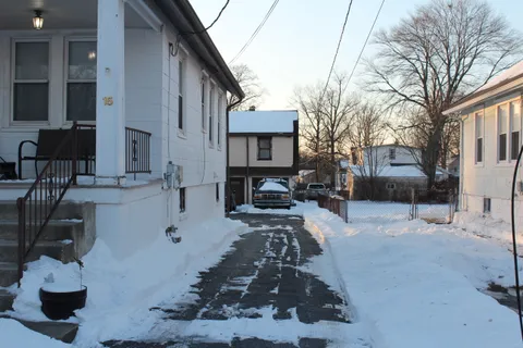 a view of a patio with couches and a fire pit