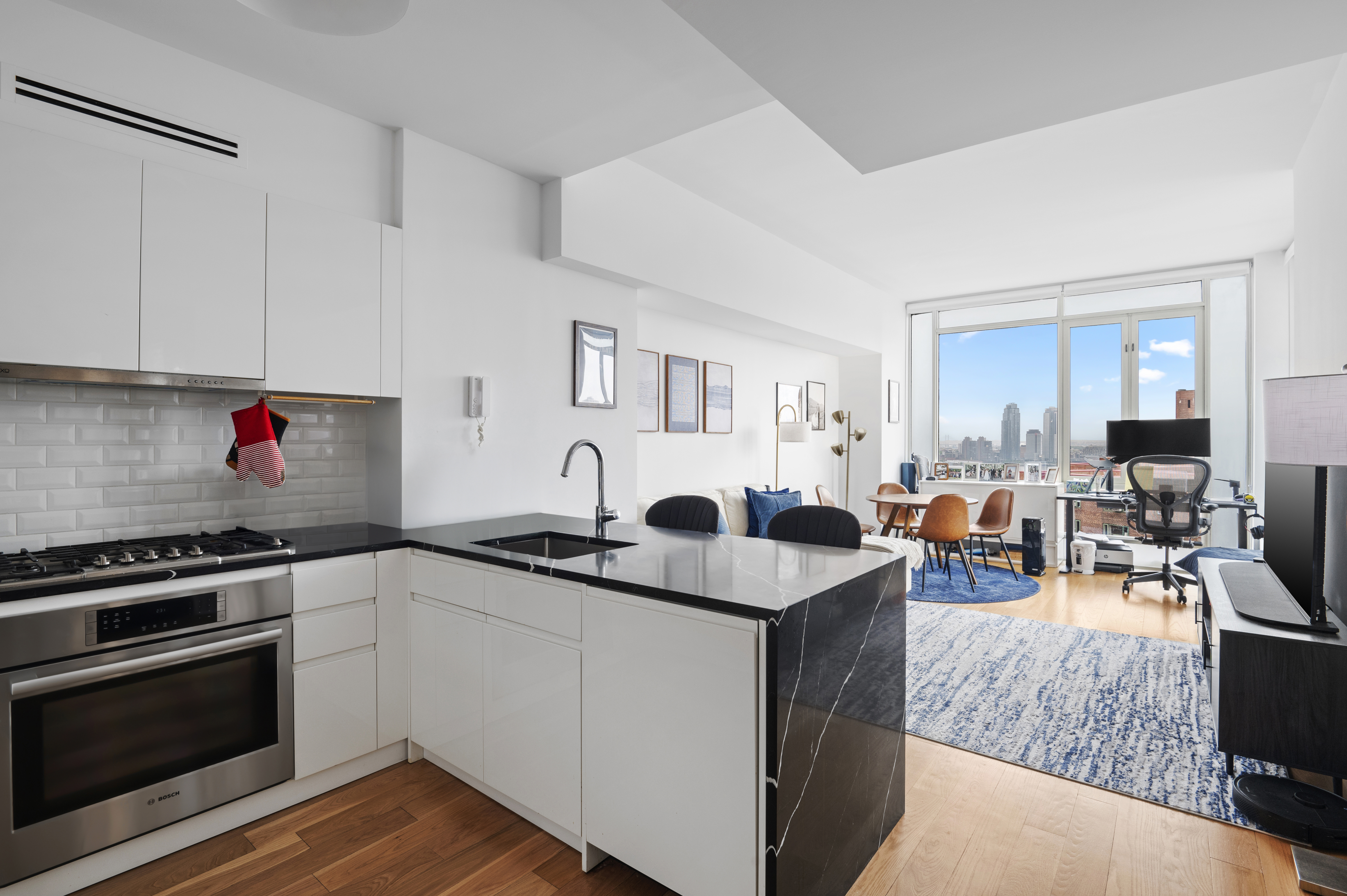 a kitchen with counter space appliances and a window