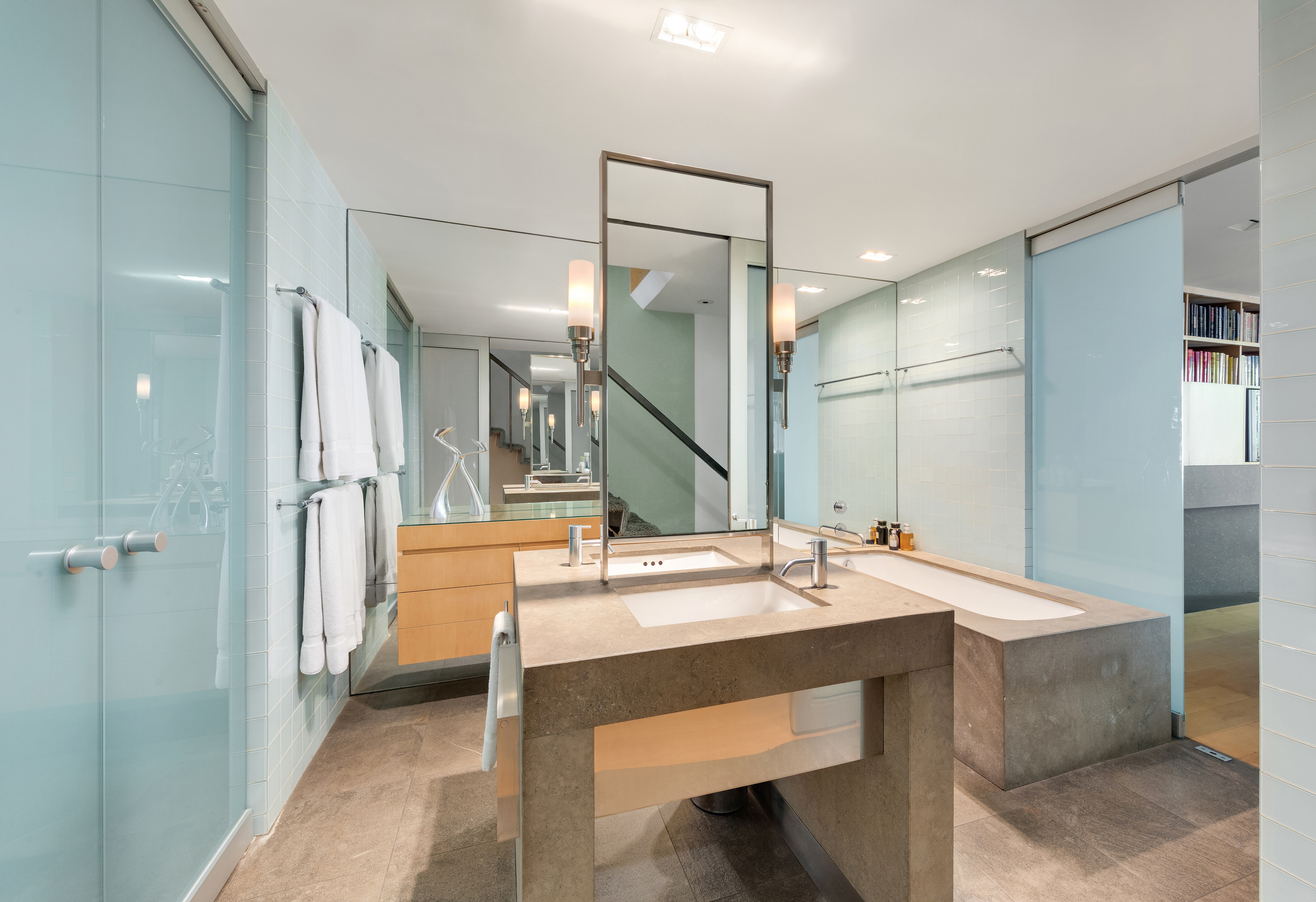 120 East 19th Street Manhattan, NY 10003 - Photo 18 of 33 a room with a table chairs and a refrigerator