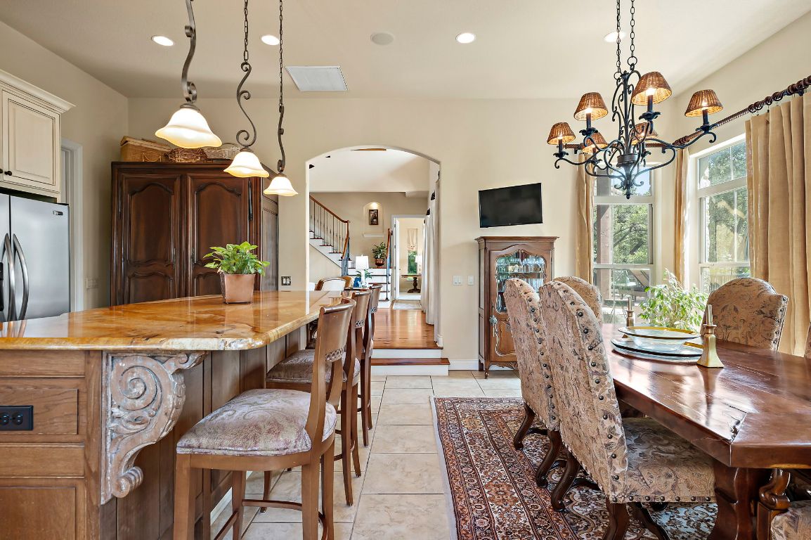 1607 The High Road Austin, TX 78746 - Photo 9 of 28 a view of a dining room with furniture window and wooden floor