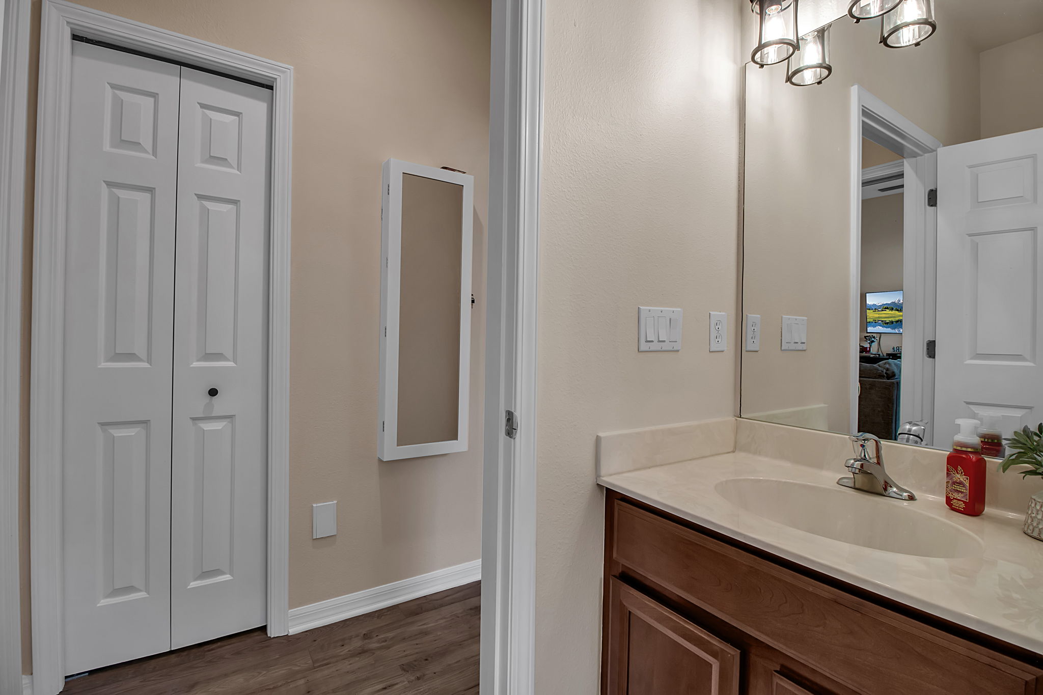 6106 34th Court East Bradenton, FL 34203 - Photo 50 of 69 a bathroom with a sink and a mirror