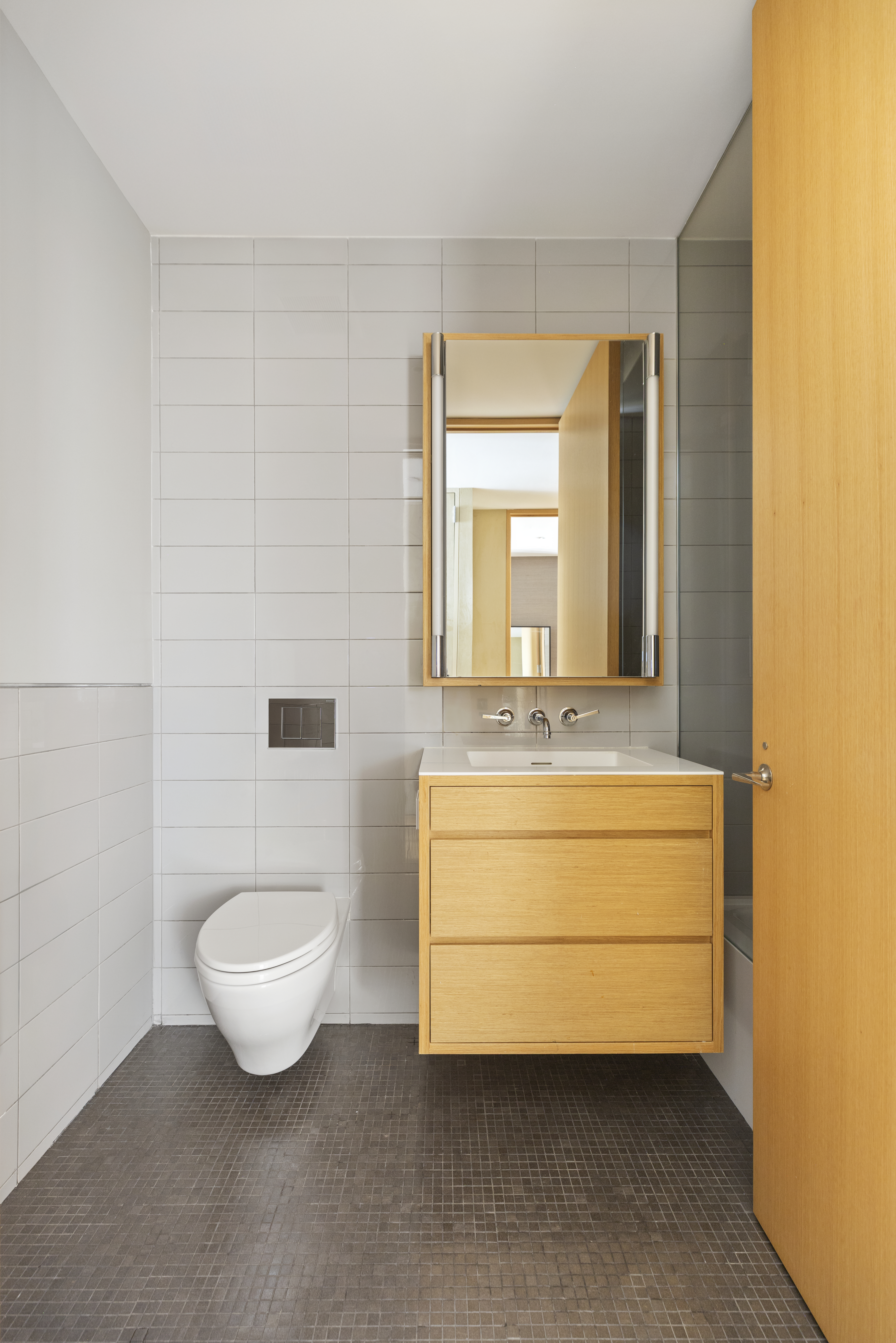 71 Reade Street, Unit 5A Manhattan, NY 10007 - Photo 16 of 27 a bathroom with a sink a toilet and mirror