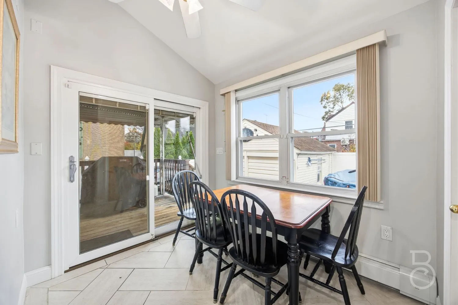 a view of a dining room with furniture window and outside view