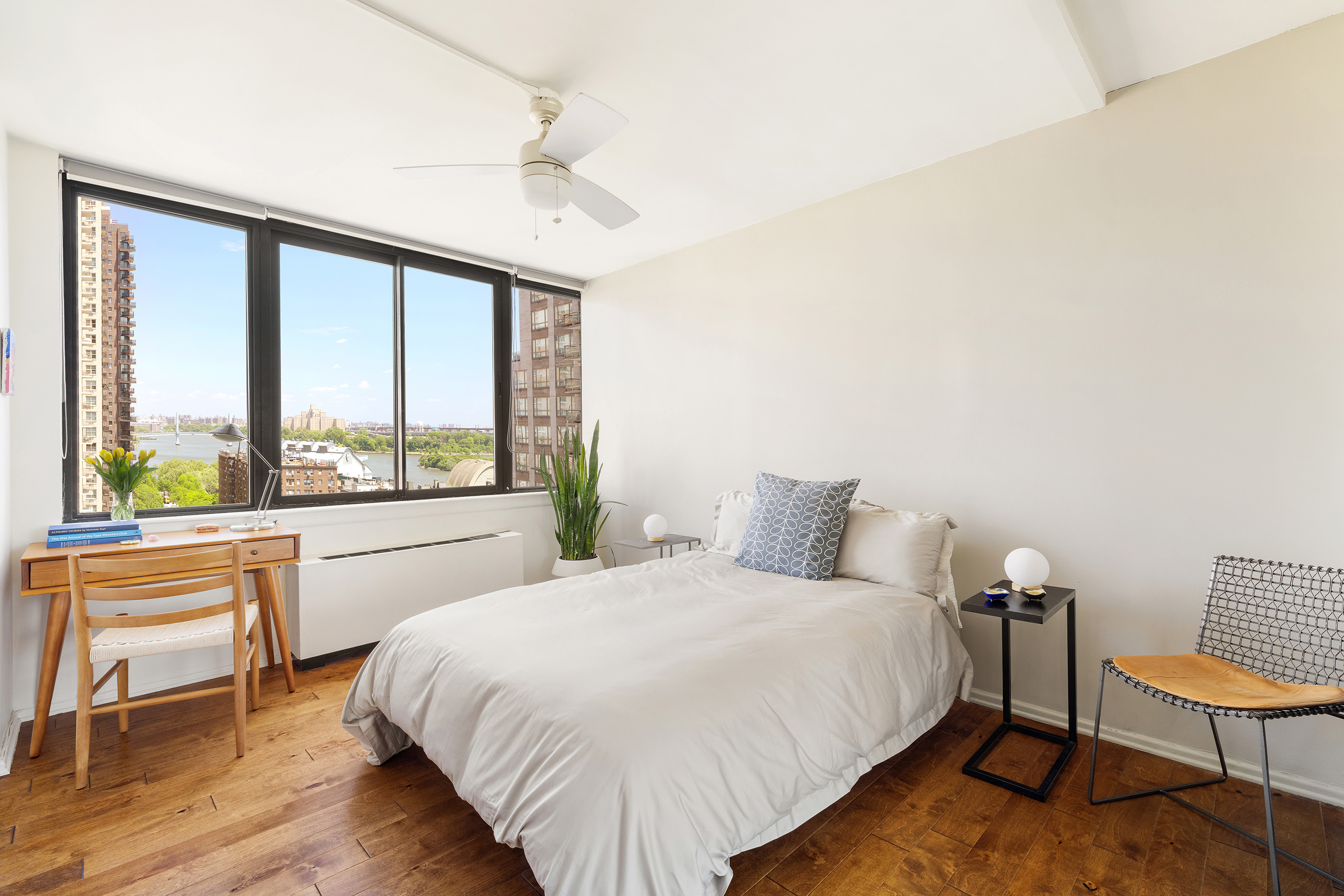 455 East 86th Street, Unit 11A Manhattan, NY 10028 - Photo 7 of 11 a large bed sitting in a bedroom next to a window