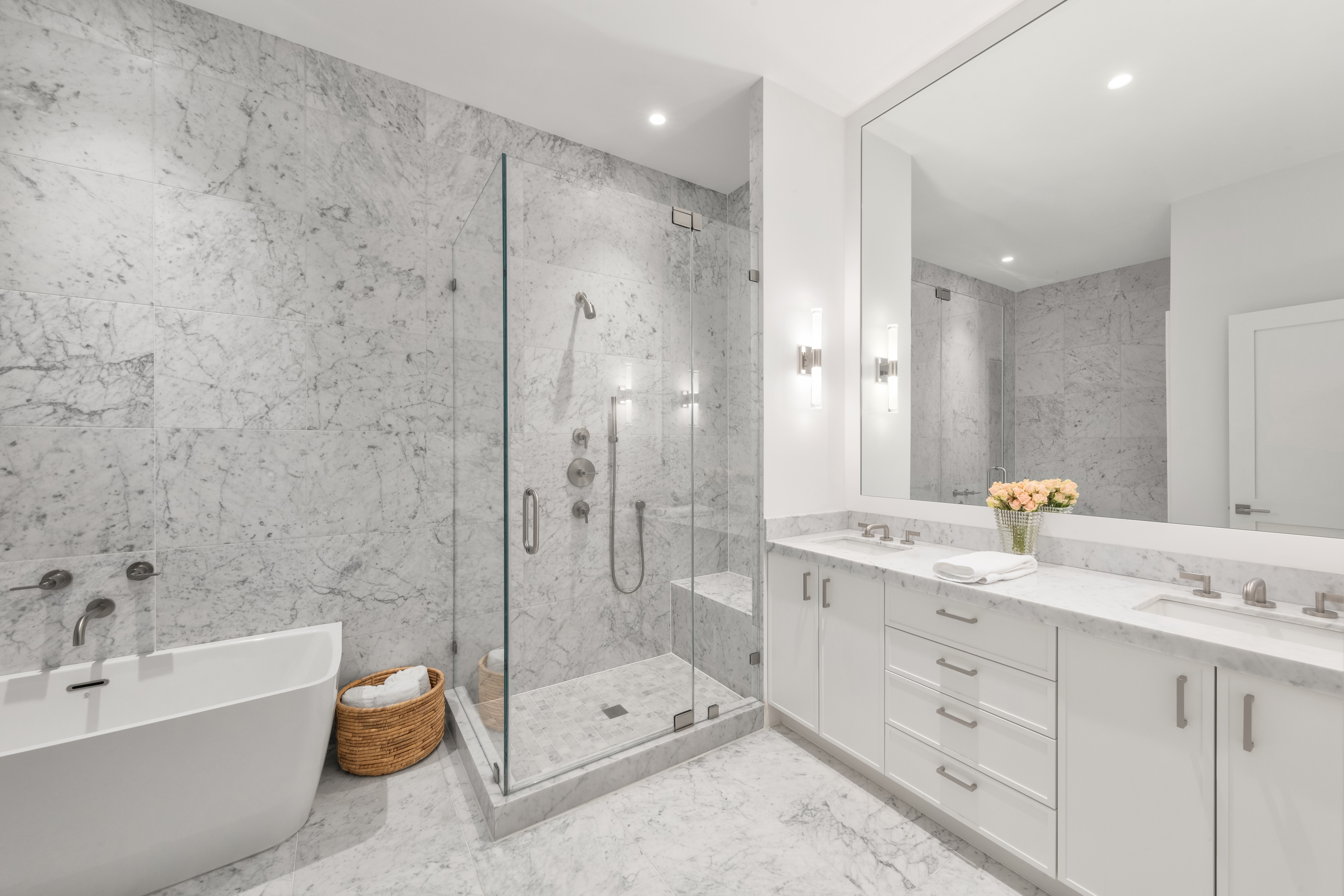 51 Warren Street, Unit 3W Manhattan, NY 10007 - Photo 10 of 13 a bathroom with a granite countertop sink a toilet a mirror and bathtub