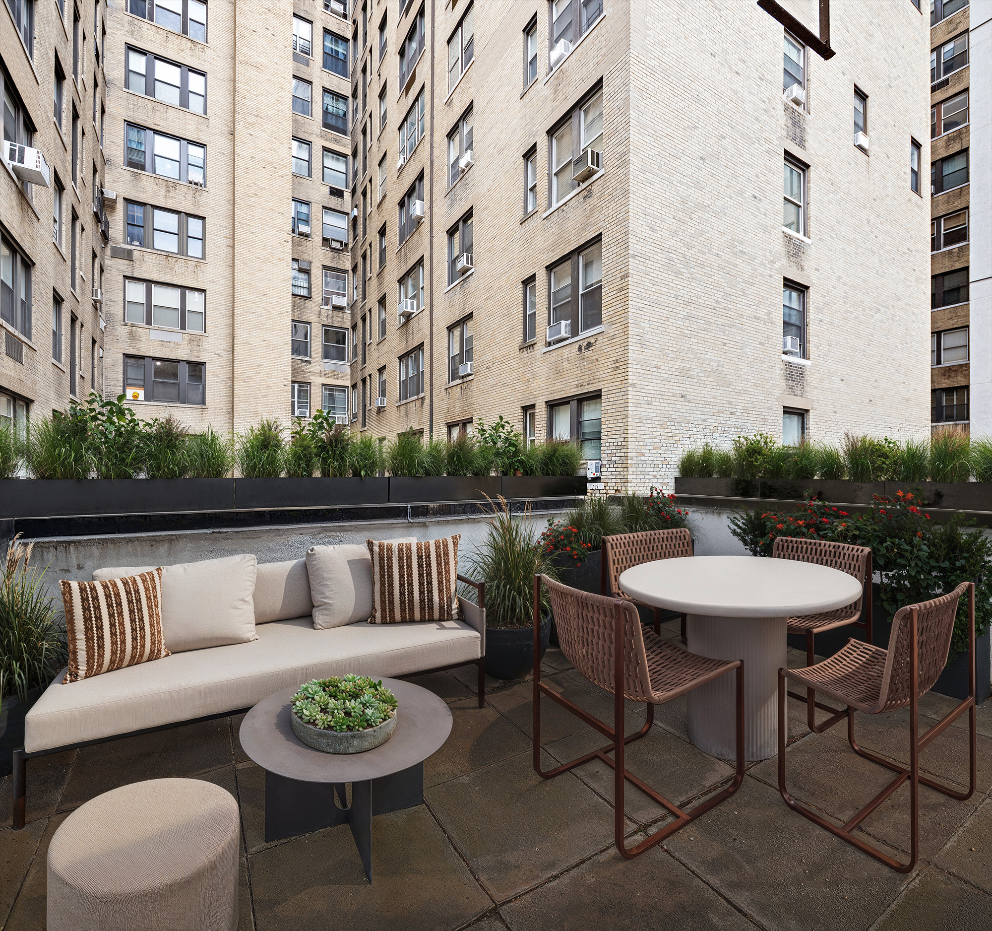 257 West 93rd Street, Unit 3C Manhattan, NY 10025 - Photo 6 of 20 a view of a patio with couches table and chairs and potted plants