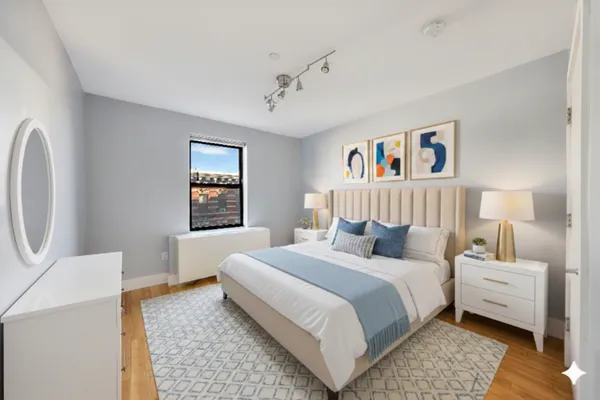 a bedroom with a bed and a couch
