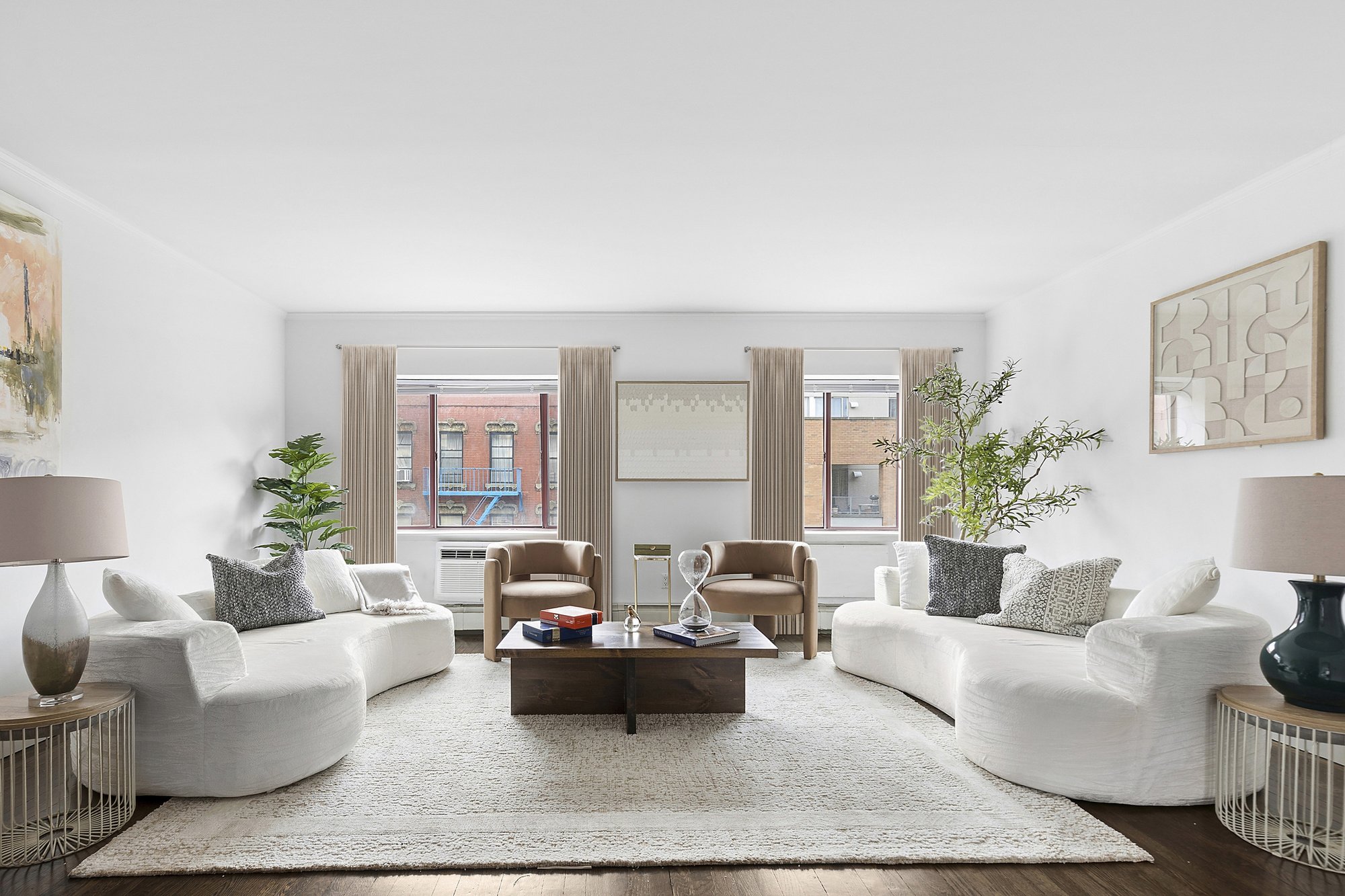 217 East 7th Street, Unit 5CD Manhattan, NY 10009 - Photo 2 of 11 a living room with furniture and a large window