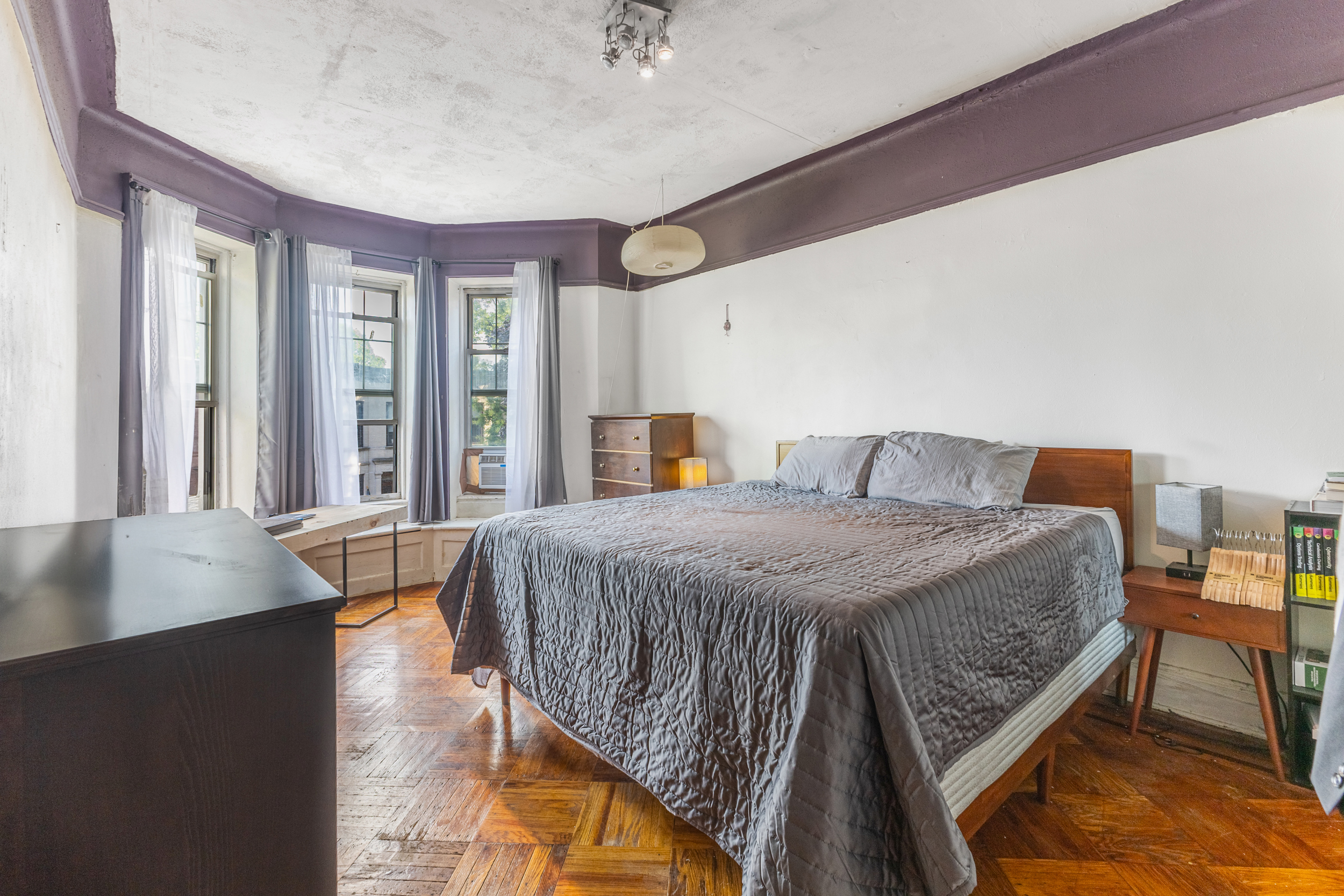 201 Maple Street Brooklyn, NY 11225 - Photo 12 of 21 a spacious bedroom with a bed and a desk
