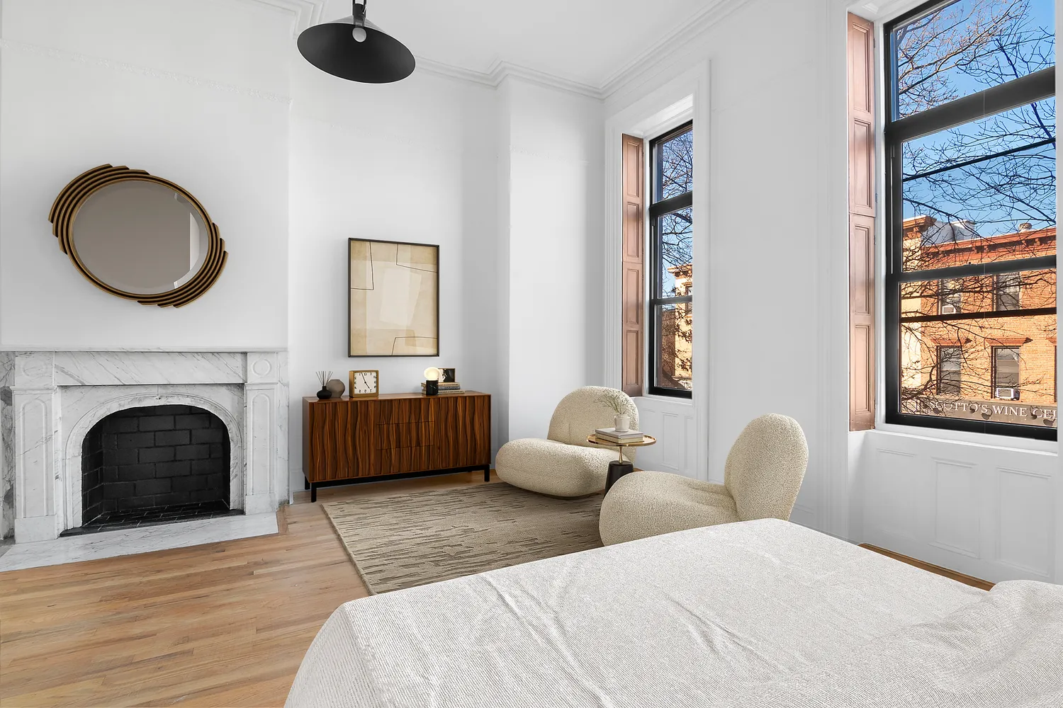 a bedroom with furniture and a fireplace