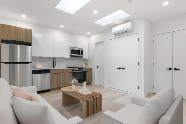 a kitchen with stainless steel appliances granite countertop a refrigerator and a sink