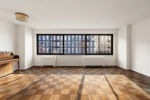 a view of empty room with windows