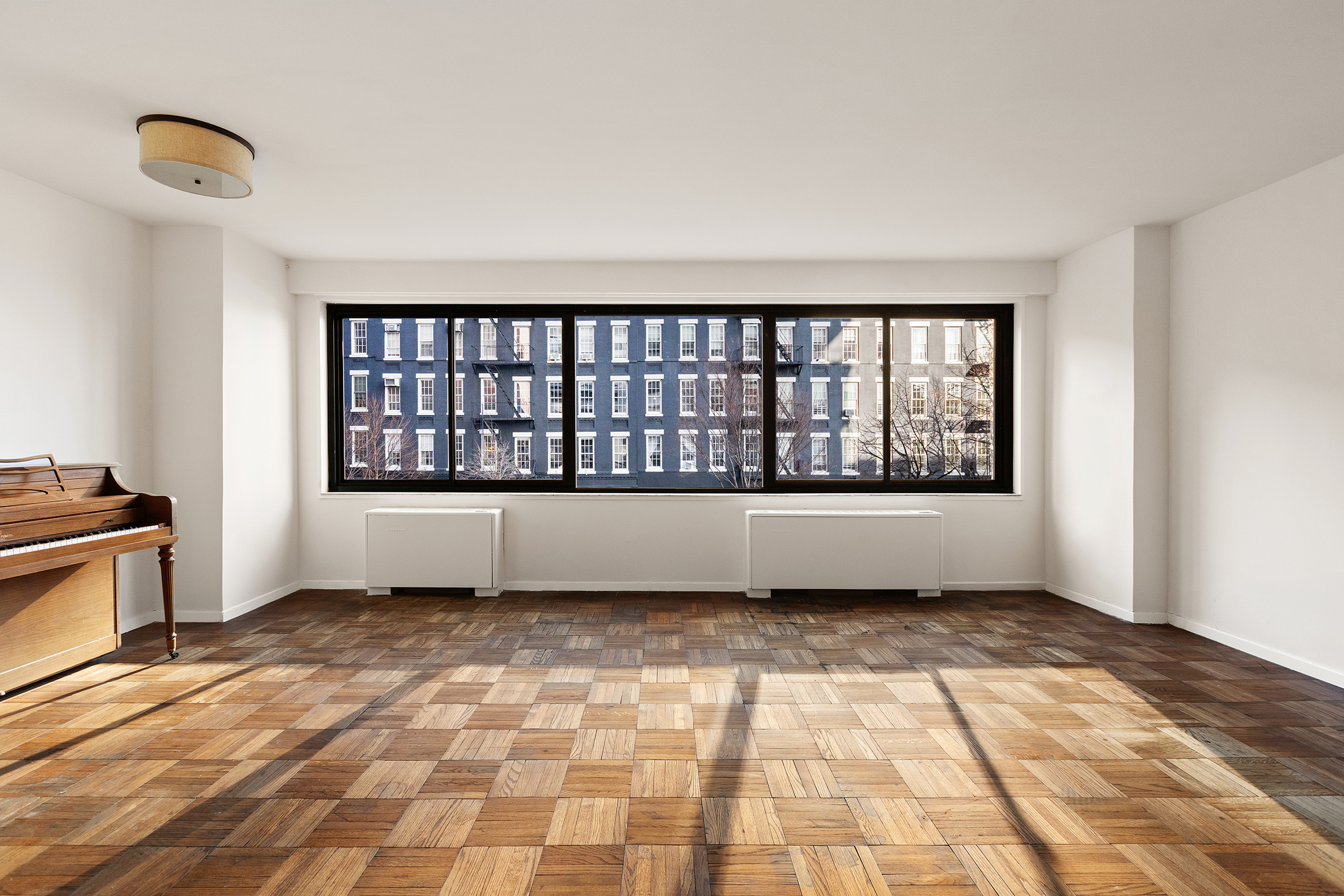 530 East 72nd Street, Unit 3C Manhattan, NY 10021 - Photo 3 of 10 a view of empty room with windows