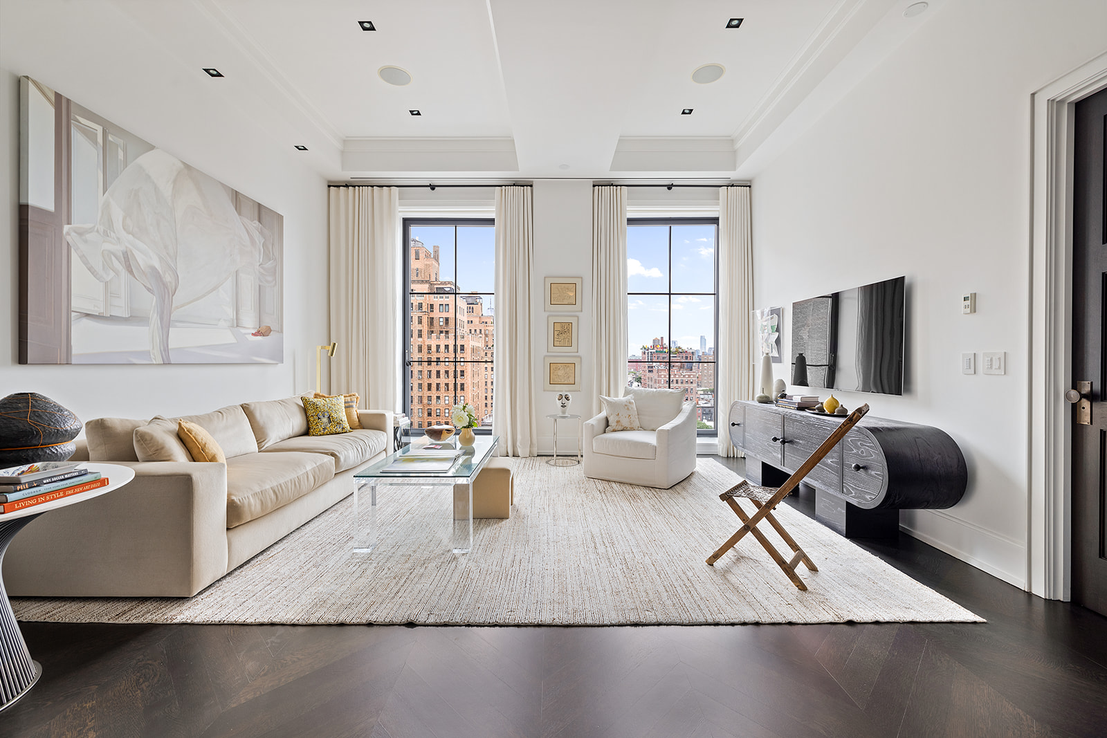 212 West 18th Street, Unit 9C Manhattan, NY 10011 - Photo 1 of 10 a living room with furniture rug and window