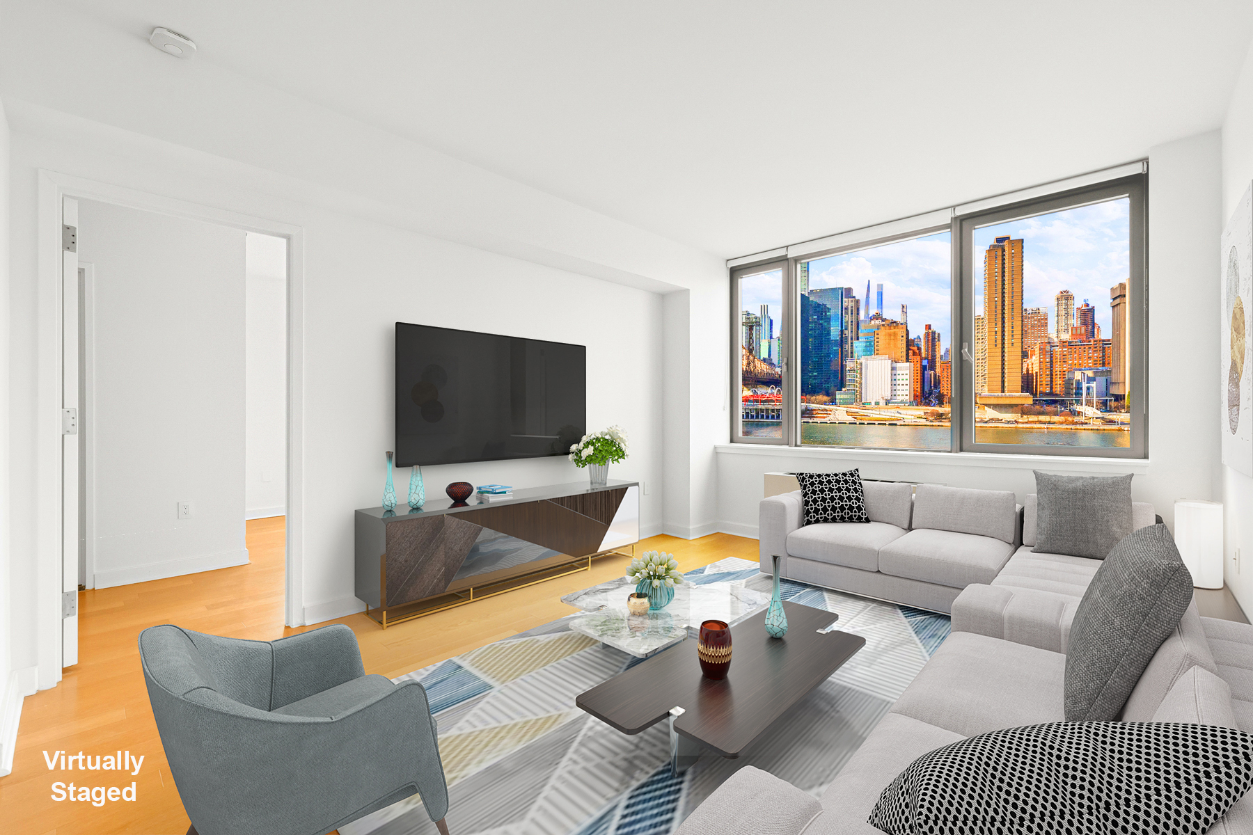 425 Main Street, Unit 9F Manhattan, NY 10044 - Photo 9 of 15 a living room with furniture and a flat screen tv