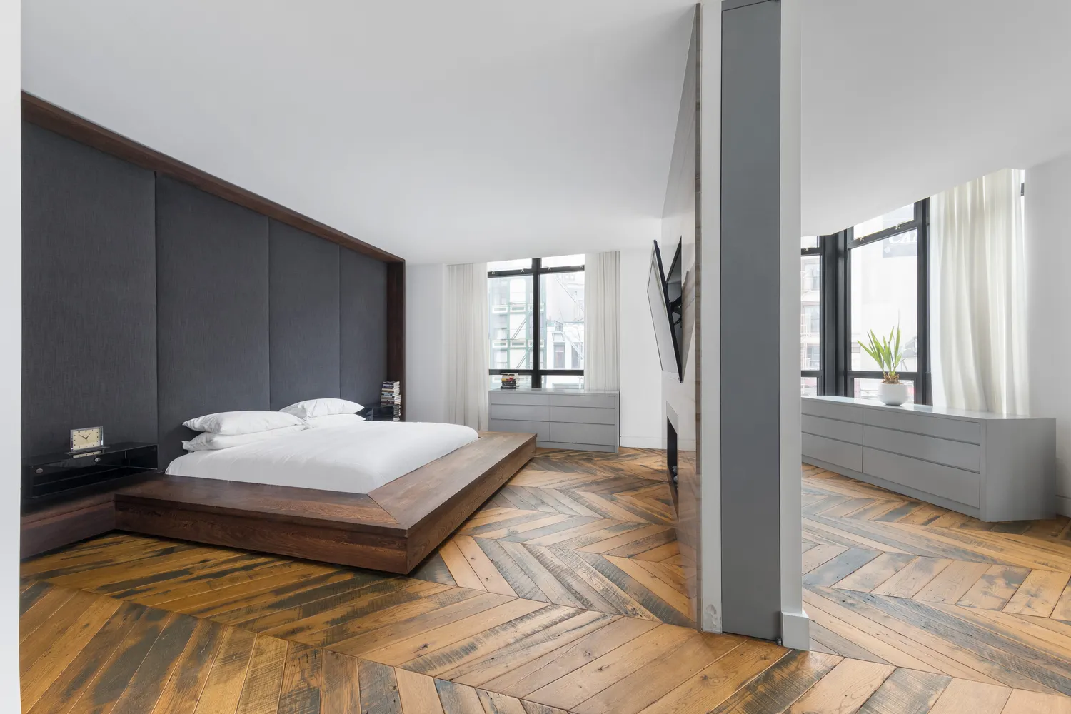 a spacious bathroom with a tub sink and mirror