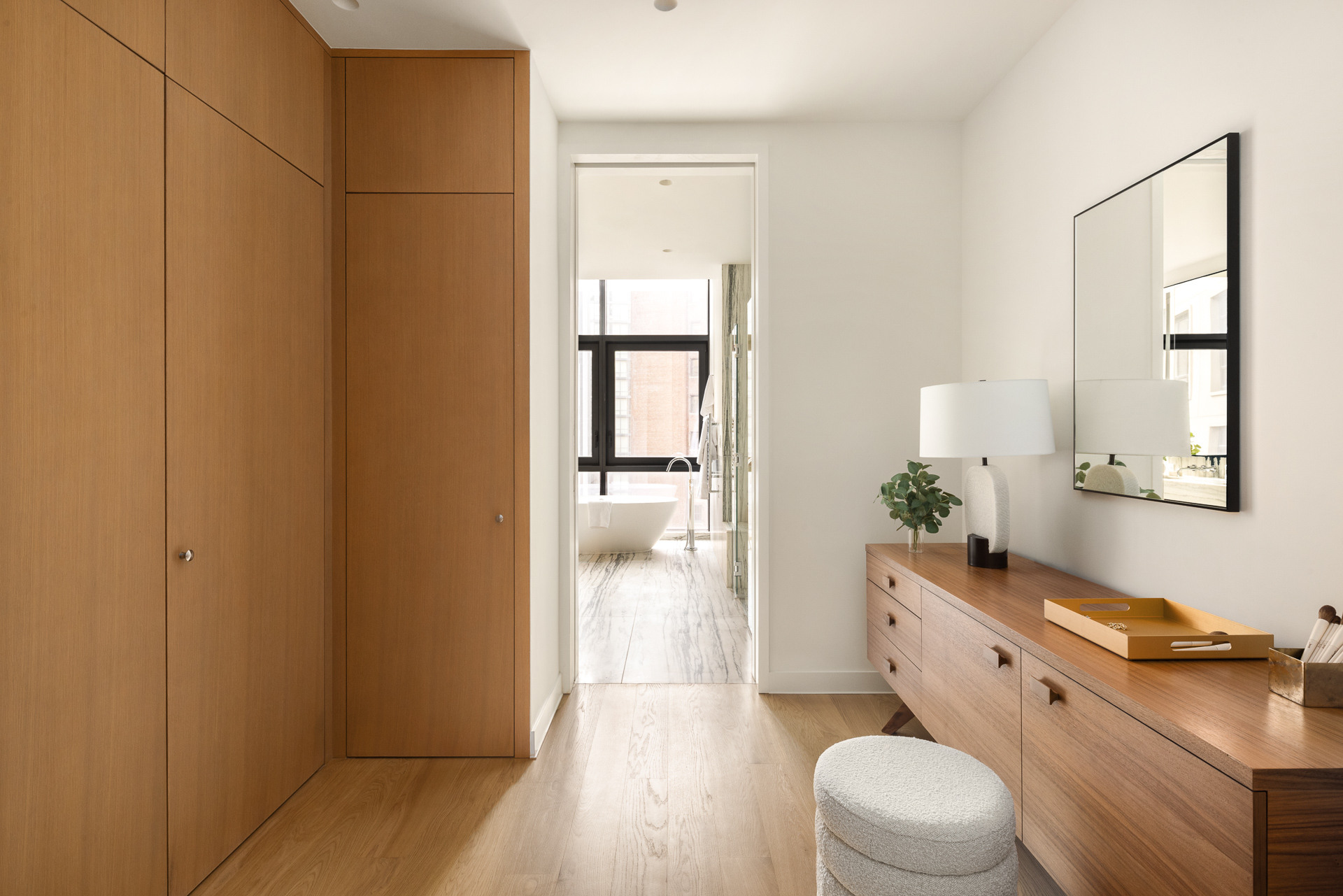 33 Park Row, Unit PH3 Manhattan, NY 10038 - Photo 15 of 30 a bathroom with a granite countertop sink mirror vanity and toilet
